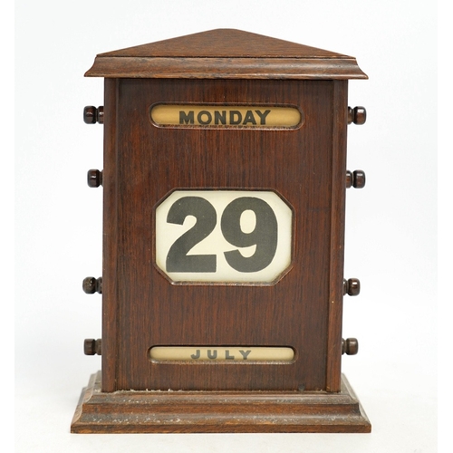 1259 - An early 20th century oak perpetual calendar, 19cm wide, 26cm high. Condition - fair