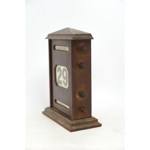 1259 - An early 20th century oak perpetual calendar, 19cm wide, 26cm high. Condition - fair