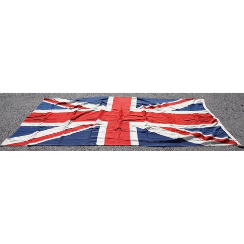 1282 - A vintage Union flag, approximately 240 x 120cm, a smaller âSaleâ flag and other assorted flags ... 