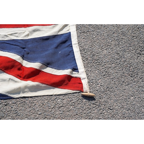 1282 - A vintage Union flag, approximately 240 x 120cm, a smaller âSaleâ flag and other assorted flags ... 