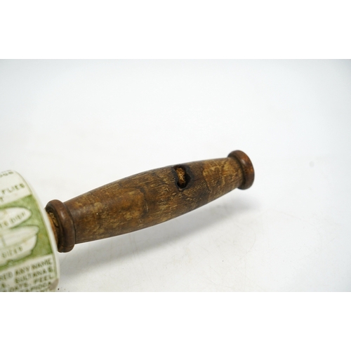 1287 - An early 20th century Grimwades green printed earthenware promotional rolling pin, 47cm wide. Condit... 