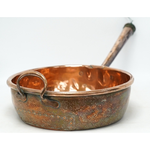 1295 - Two copper pans, one handled and the other with cover, 38cm diameter. Condition - fair