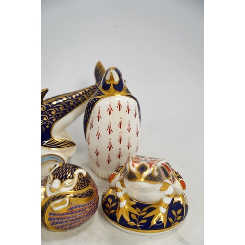 1300 - Eight Royal Crown Derby porcelain paperweights in the form of animals including a penguin, rabbit an... 