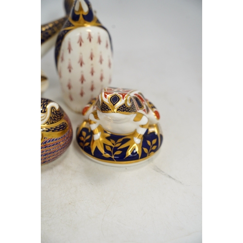 1300 - Eight Royal Crown Derby porcelain paperweights in the form of animals including a penguin, rabbit an... 