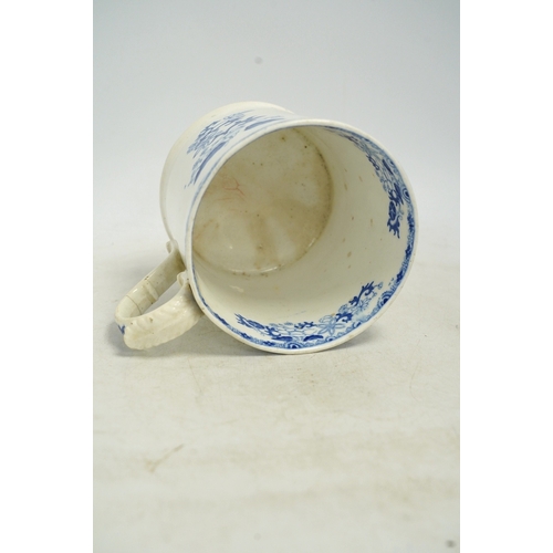 1303 - An early Victorian blue and white bone china mug, 13cm high. Condition - fair, crack to the handle... 