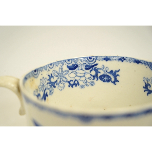 1303 - An early Victorian blue and white bone china mug, 13cm high. Condition - fair, crack to the handle... 