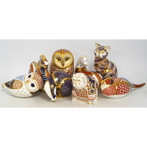 1305 - Eight Royal Crown Derby porcelain paperweights in the form of animals including a cat, badger and ow... 