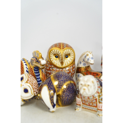 1305 - Eight Royal Crown Derby porcelain paperweights in the form of animals including a cat, badger and ow... 