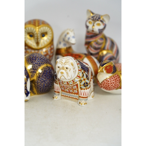 1305 - Eight Royal Crown Derby porcelain paperweights in the form of animals including a cat, badger and ow... 