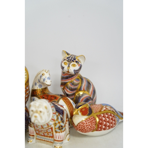 1305 - Eight Royal Crown Derby porcelain paperweights in the form of animals including a cat, badger and ow... 