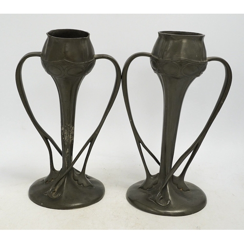 1307 - A pair of Art Nouveau Liberty Tudric pewter twin-handled vases, stamped to the bases, 25cm high. Con... 