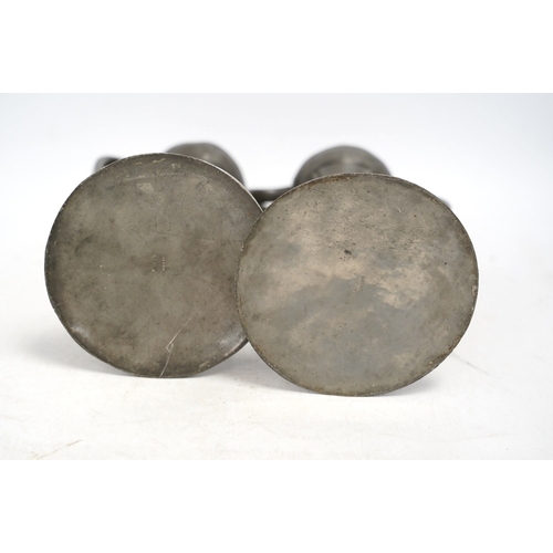 1307 - A pair of Art Nouveau Liberty Tudric pewter twin-handled vases, stamped to the bases, 25cm high. Con... 