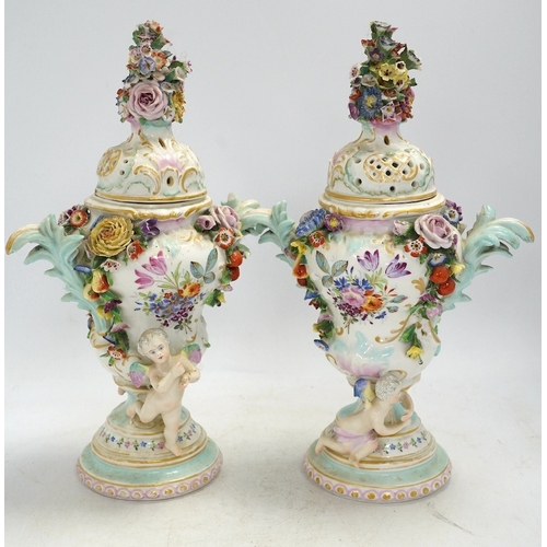 1308 - A pair of Potschappel porcelain floral encrusted vases and covers, 31cm high. Condition - poor... 