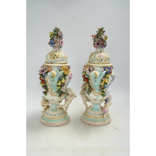 1308 - A pair of Potschappel porcelain floral encrusted vases and covers, 31cm high. Condition - poor... 