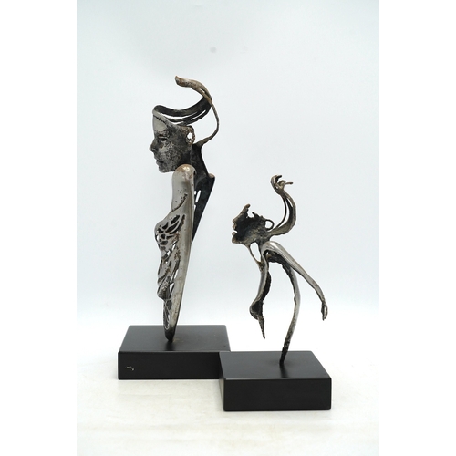 1311 - Two contemporary 'Brutalist' cast iron sculptures, initialled RI, tallest 39cm. Condition - fair to ... 