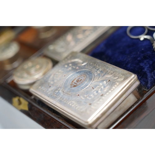 1314 - A Victorian rosewood toilet box with silver plate lidded bottles, âsecretâ draw and leather case... 