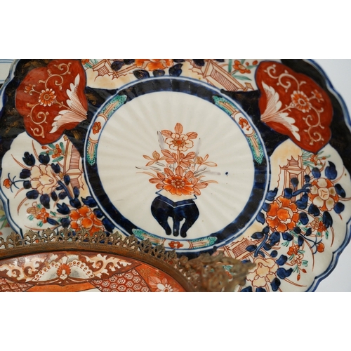 1315 - Five Japanese Imari dishes and a Kutani gilt metal mounted bowl, Meiji period, largest 35cm. Conditi... 