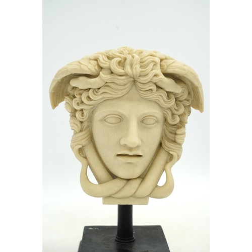 1316 - A decorative resin bust of Medusa and a pair of brass candle stands, 40cm. Condition - fair