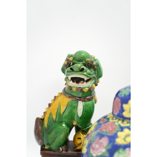 1325 - A pair of Chinese lion dogs and a floral enamelled jar and cover, largest 26cm high. Condition - goo... 