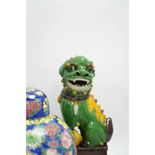 1325 - A pair of Chinese lion dogs and a floral enamelled jar and cover, largest 26cm high. Condition - goo... 