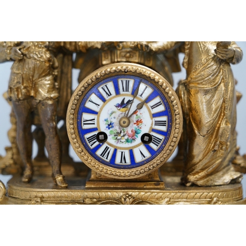 1329 - A large gilt metal figural mantel clock with floral porcelain dial and panels, under a glass dome, 5... 