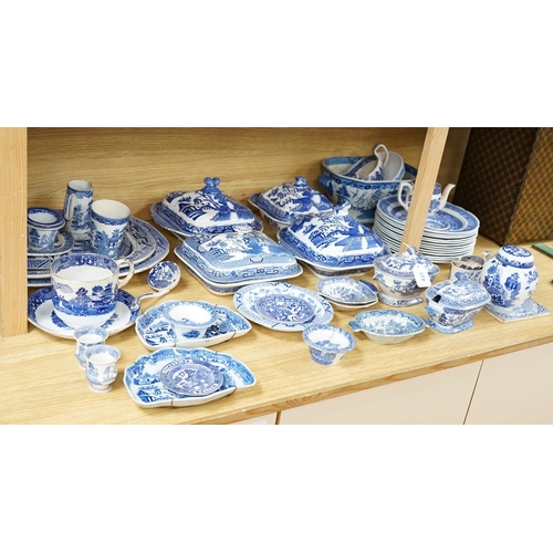 431 - A mixed collection of Willow pattern blue and white dinnerware, including four tureens and covers, p... 