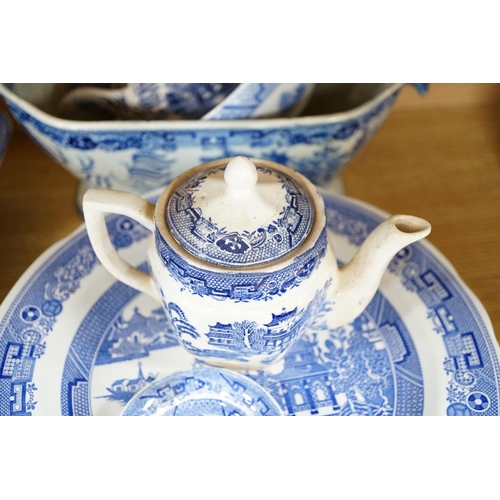 431 - A mixed collection of Willow pattern blue and white dinnerware, including four tureens and covers, p... 