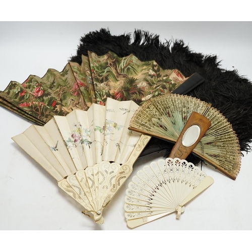 464 - A black ostrich feather and tortoiseshell fan and four others including a carved bone and floral pai... 