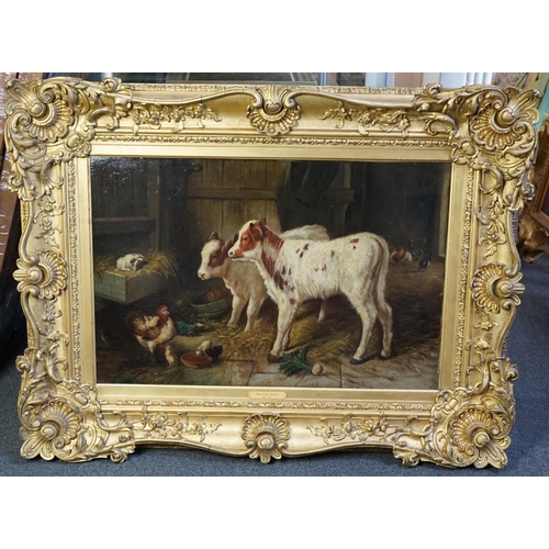 39 - Walter Hunt (1861-1941) Calves, a puppy and poultry in a barnoil on canvas50 x 75cm... 