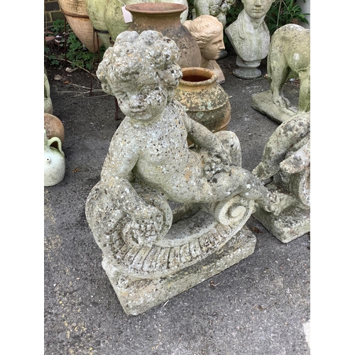 129 - A pair of reconstituted stone putti and scroll garden ornaments, height 68cm. Condition - poor to fa... 