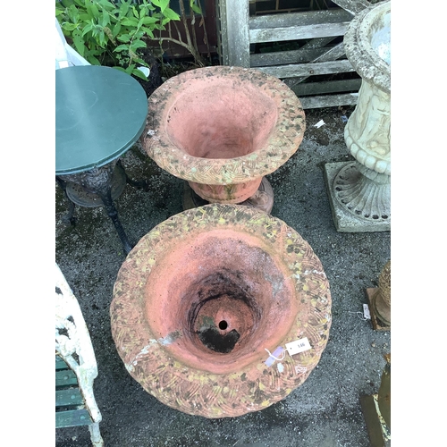 146 - A pair of circular terracotta garden urns with basket weave bodies on lion's paw feet, diameter  72c... 