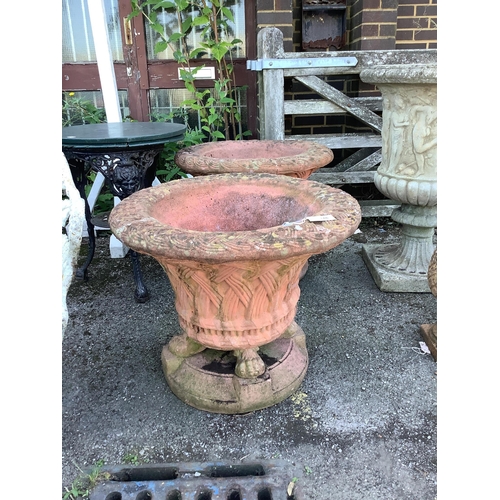 146 - A pair of circular terracotta garden urns with basket weave bodies on lion's paw feet, diameter  72c... 