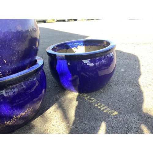 154 - Nine circular dark blue glazed earthenware garden planters, diameter 53cm, height 31cm. Condition - ... 