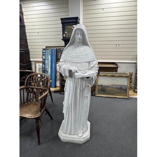 159 - A late 19th/early 20th century life sized figure of a standing nun holding a book, height 158cm. Con... 