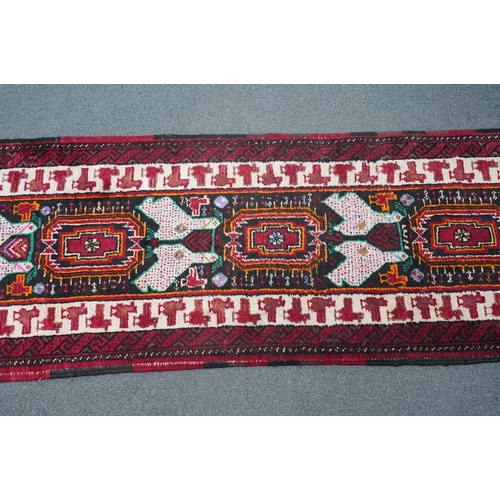 173 - A Turkish red ground geometric runner, 266 x 63cm. Condition - good