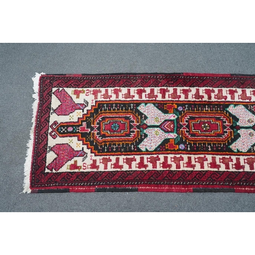 173 - A Turkish red ground geometric runner, 266 x 63cm. Condition - good