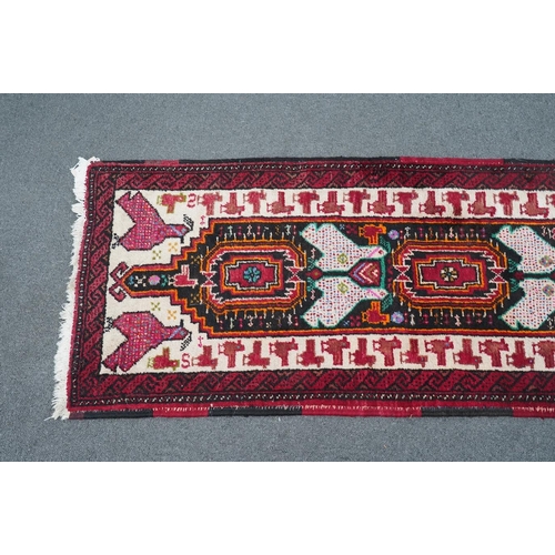 173 - A Turkish red ground geometric runner, 266 x 63cm. Condition - good