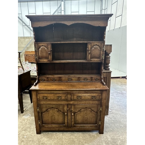 174 - A small 18th century style oak dresser with boarded rack, width 118cm, depth 44cm, height 188cm.... 