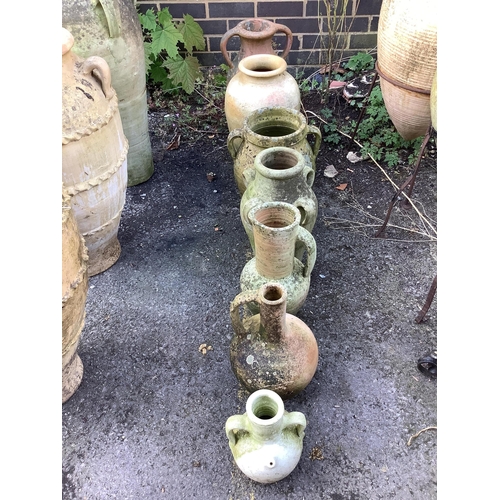 18 - Seven terracotta and earthenware jars and urns, largest height 48cm. Condition - fair