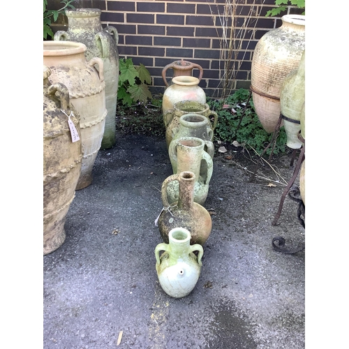 18 - Seven terracotta and earthenware jars and urns, largest height 48cm. Condition - fair