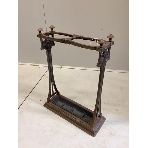 2 - An Art Nouveau two division cast iron stickstand, width 44cm, depth 13cm, height 60cm. Condition - f... 