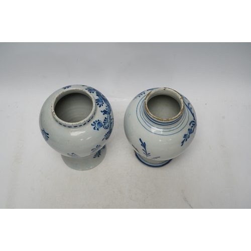 252 - Two 18th century delft blue and white baluster vases, 18.5cm