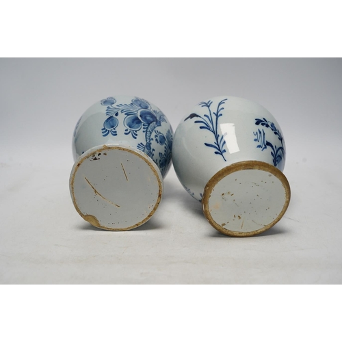 252 - Two 18th century delft blue and white baluster vases, 18.5cm