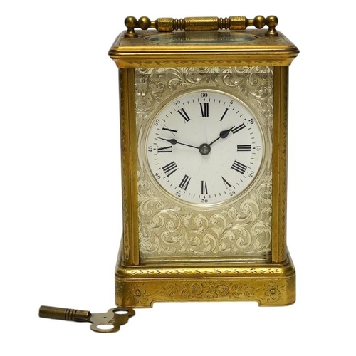 253 - An engraved brass carriage clock by Richard & Cie, serial number 648, with key, 14cm. Condition - fa... 