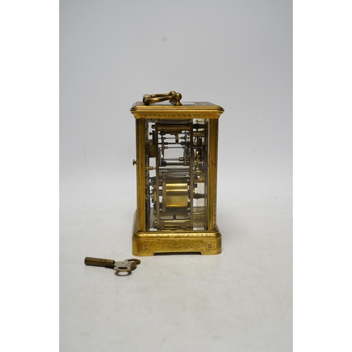 253 - An engraved brass carriage clock by Richard & Cie, serial number 648, with key, 14cm. Condition - fa... 