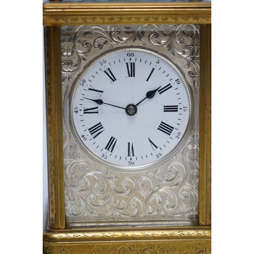 253 - An engraved brass carriage clock by Richard & Cie, serial number 648, with key, 14cm. Condition - fa... 