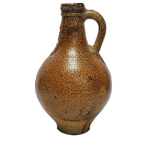 255 - A 17th century Rhenish saltglazed Bellarmine, 23cm. Condition - commensurate with age