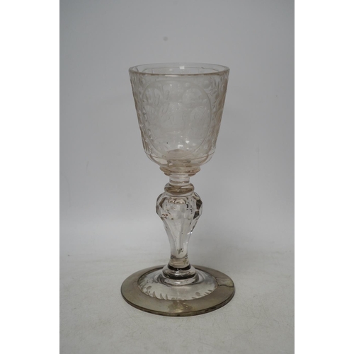 268 - A Victorian engraved tall stemmed wine glass with white metal mounted foot rim, 22cm high. Condition... 