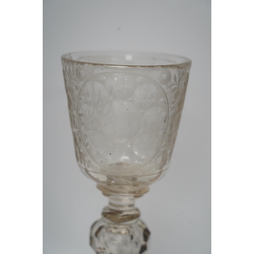 268 - A Victorian engraved tall stemmed wine glass with white metal mounted foot rim, 22cm high. Condition... 