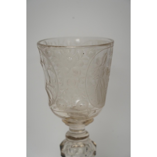 268 - A Victorian engraved tall stemmed wine glass with white metal mounted foot rim, 22cm high. Condition... 